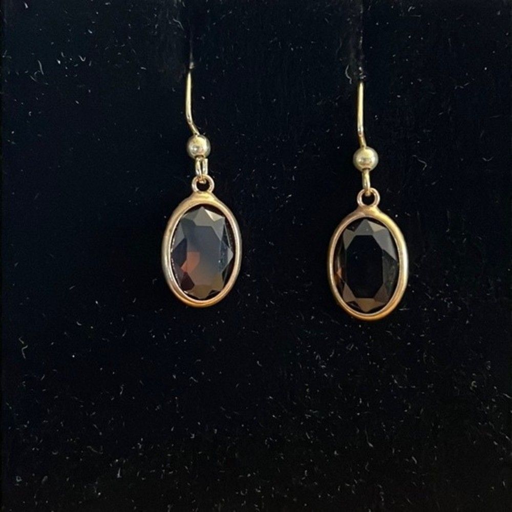 Handcrafted gold  tone earrings with a brown colored stone.